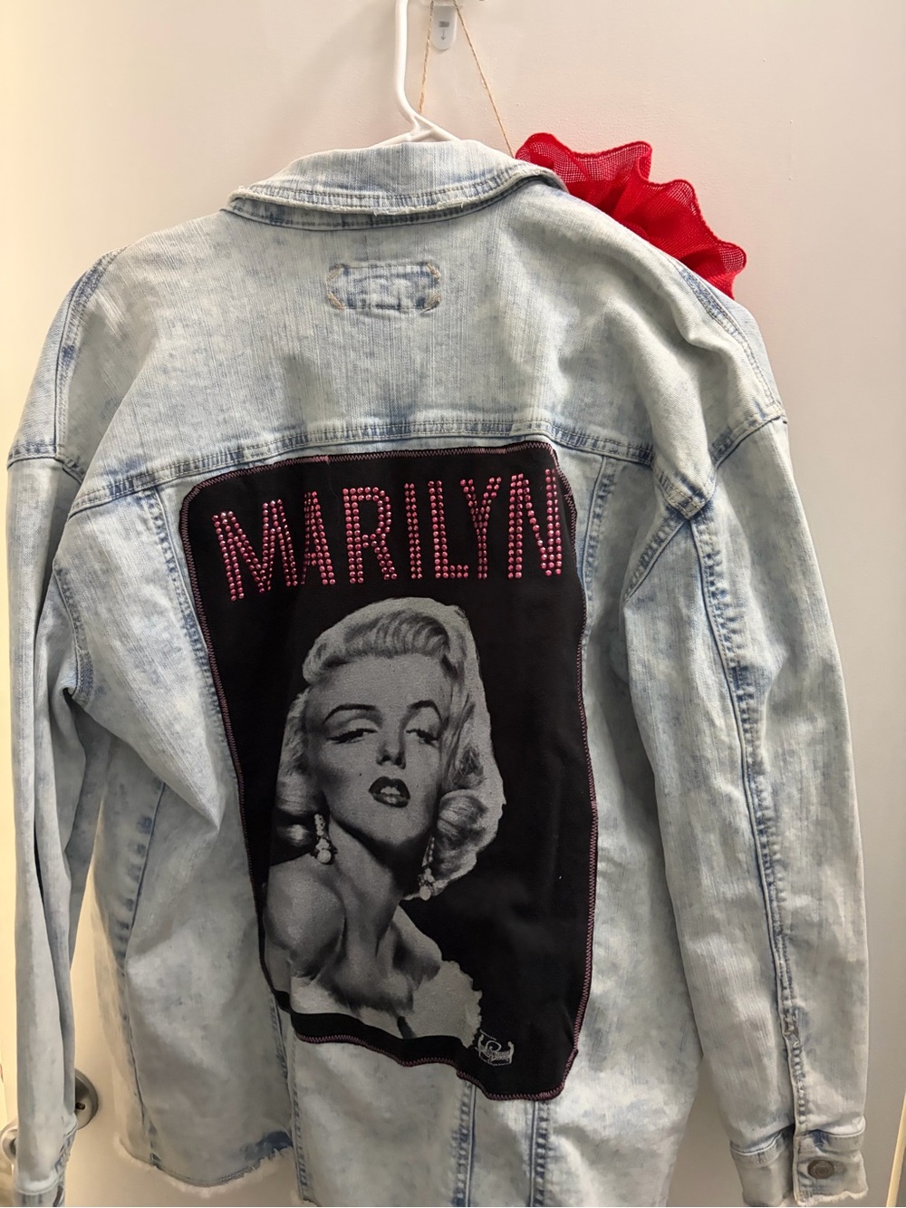 Maurices Light Wash Denim Jacket with Black Back Patch and Pink Studs